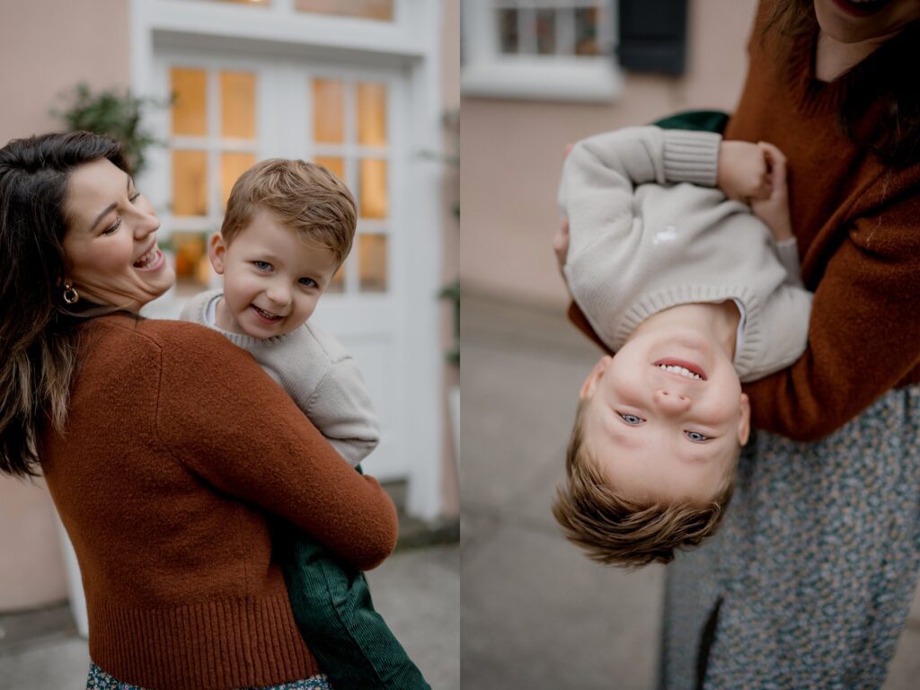 A woman with brown hair and a rust-colored sweater joyfully holds a smiling young boy. In the first image, she cradles him in her arms outdoors during one of their Charleston mini sessions. In the second, she holds him upside down, both laughing and having fun in front of a house with a door and windows.