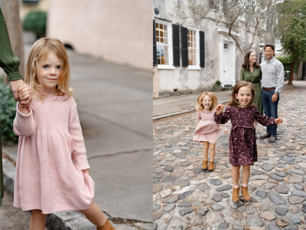 A young blonde girl in a pink dress holds an adult’s hand on the left; on the right, she and another girl walk ahead of two smiling adults on a cobblestone street, all wearing fall outfits.